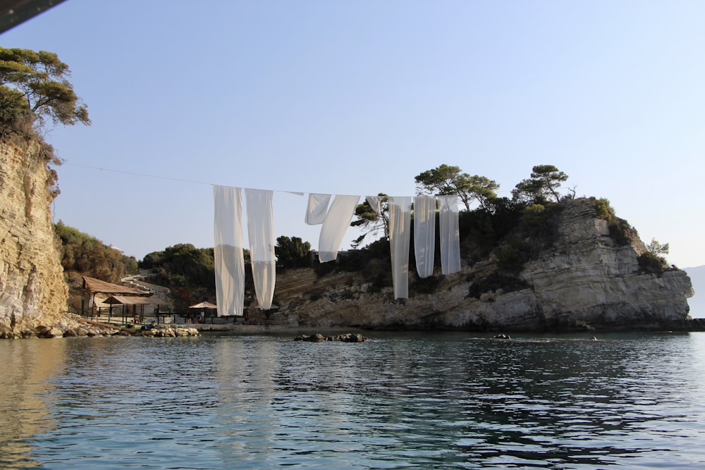 white boat on body of water during daytime