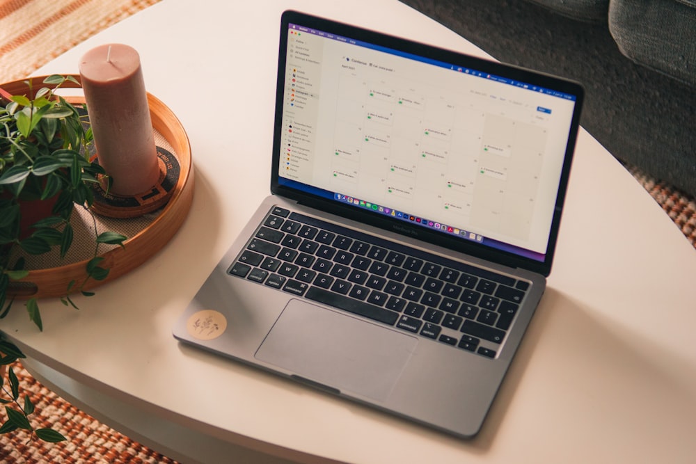 macbook pro on white table