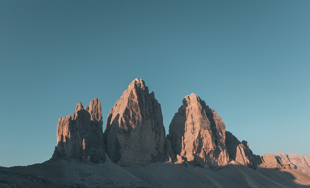 brown rocky mountain under blue sky during daytime