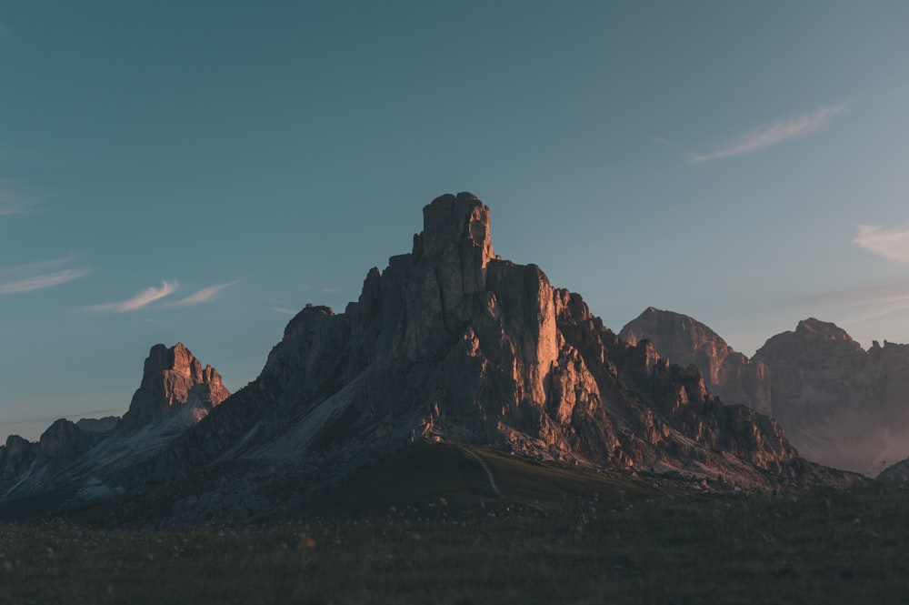 brown rocky mountain under blue sky during daytime