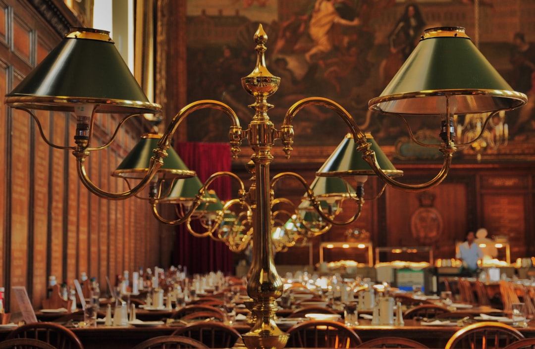 brass and white table lamp on table