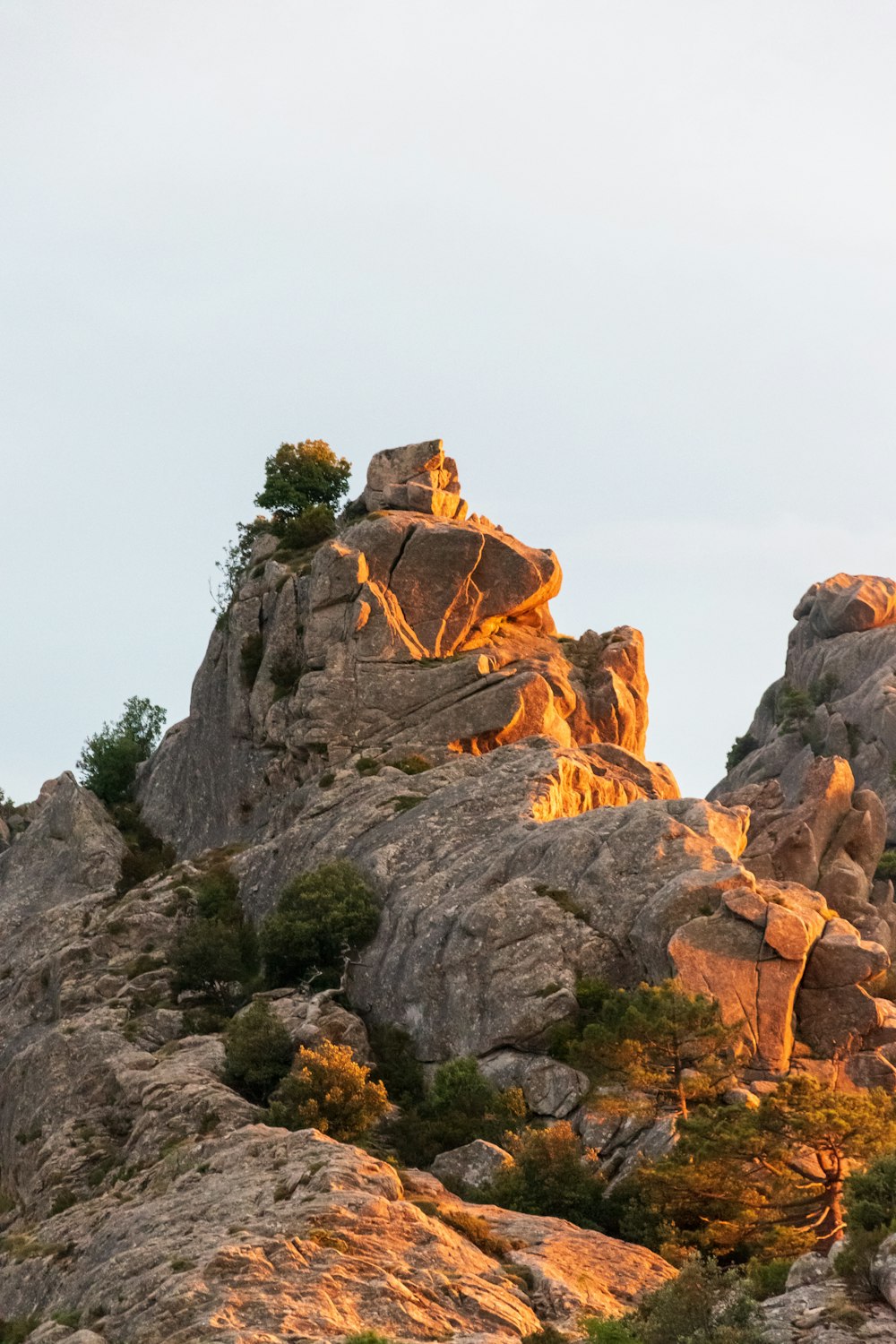 brown rock formation under white sky during daytime