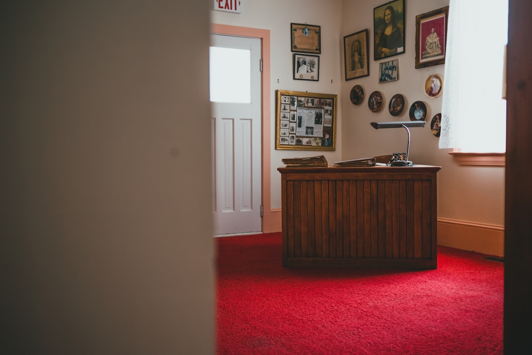 brown wooden desk with chair