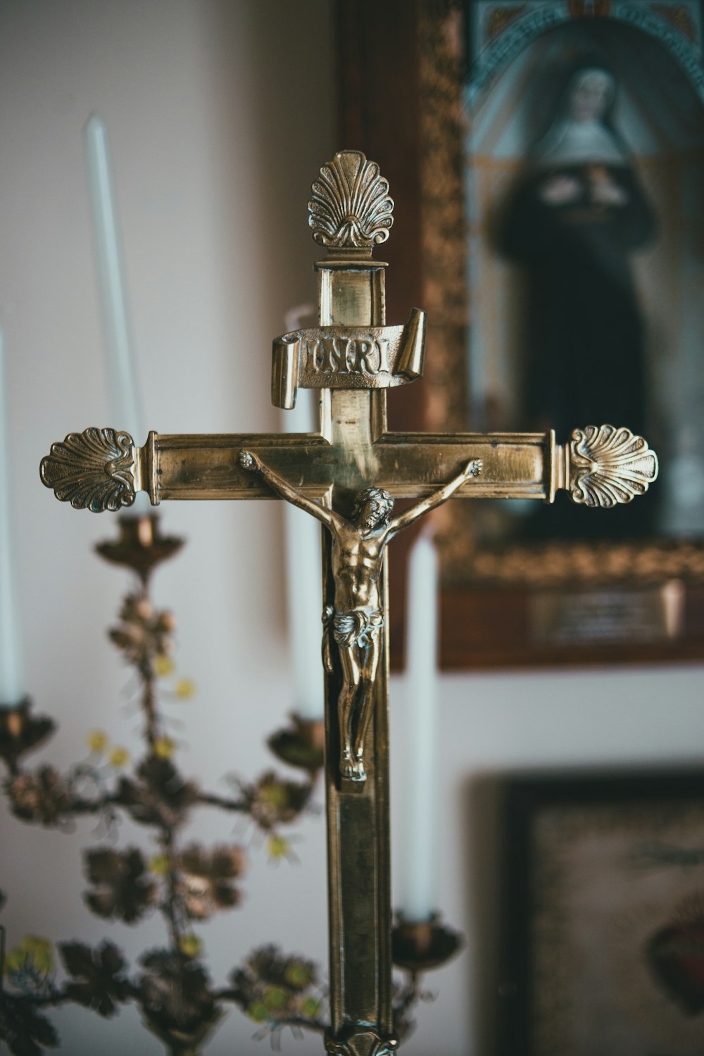 gold crucifix on white wall