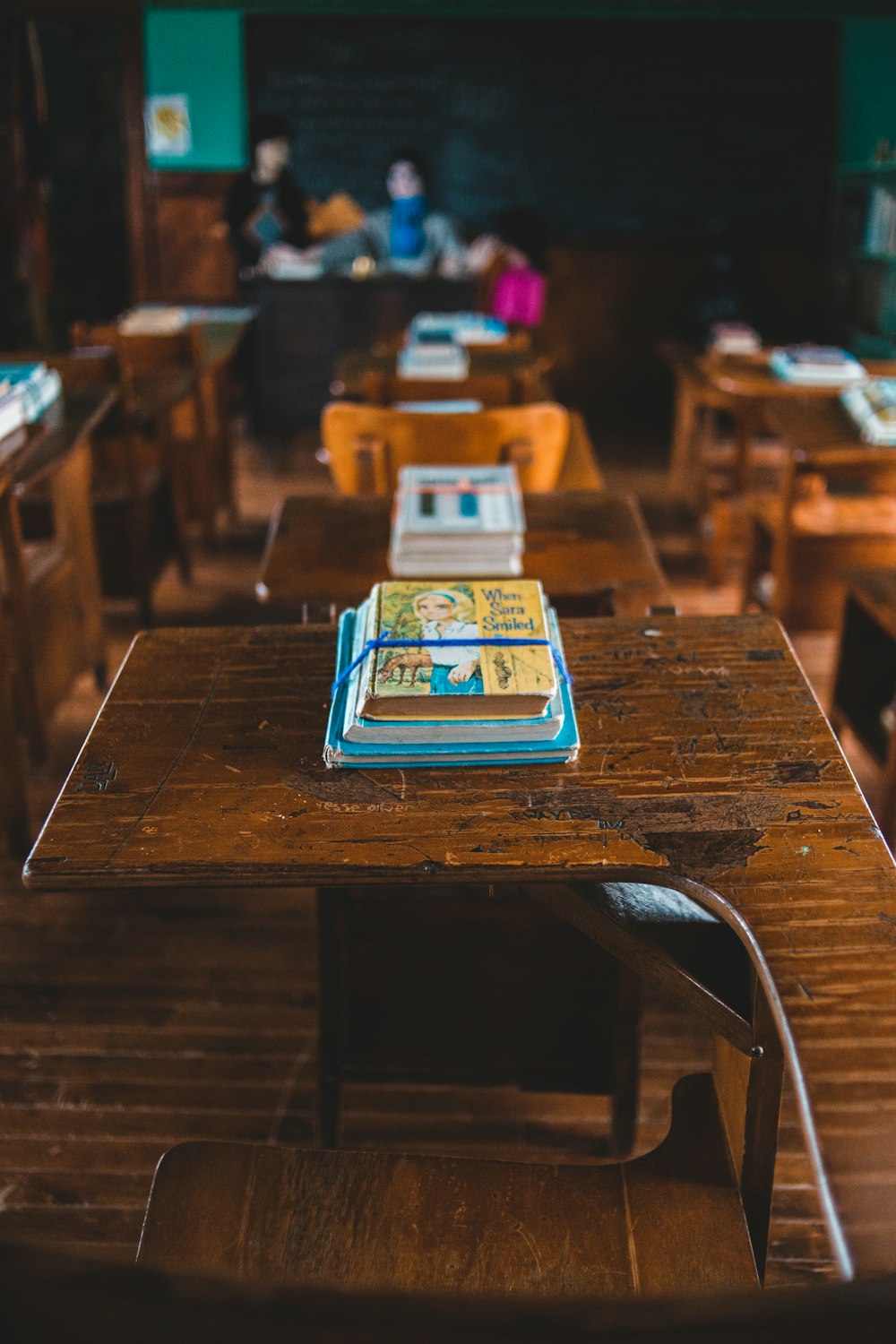 white ipad on brown wooden table