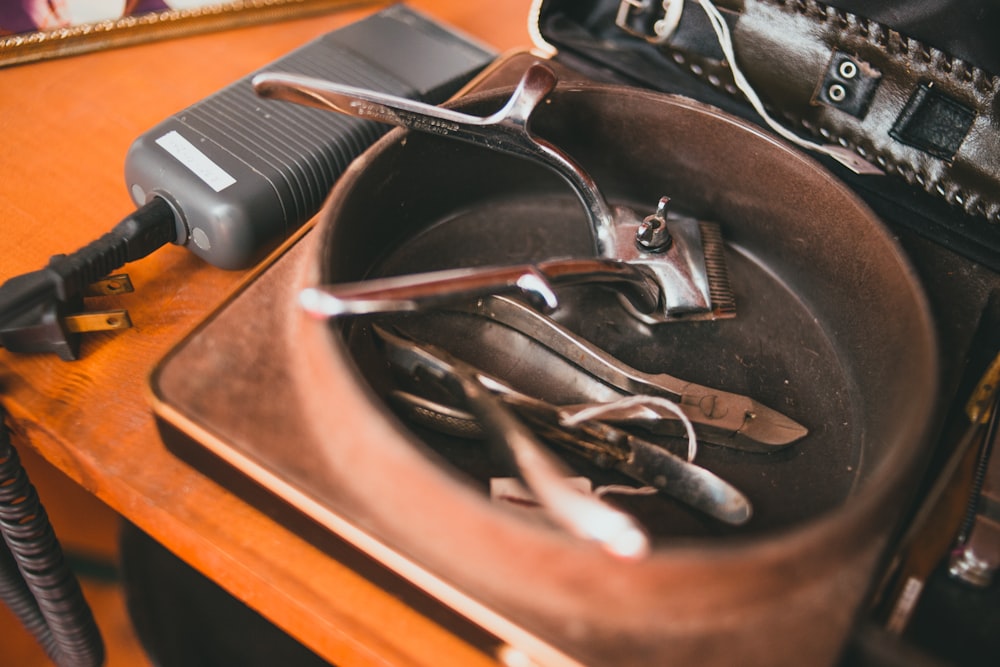 black hair comb on brown wooden table