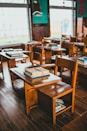 brown wooden table with books on top
