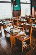 brown wooden table with books on top