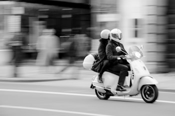man riding motorcycle on road during daytime