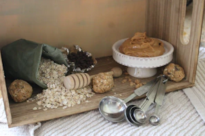 A cozy kitchen scene showing a jar of yara essentials jaggery powder next to fresh ingredients
