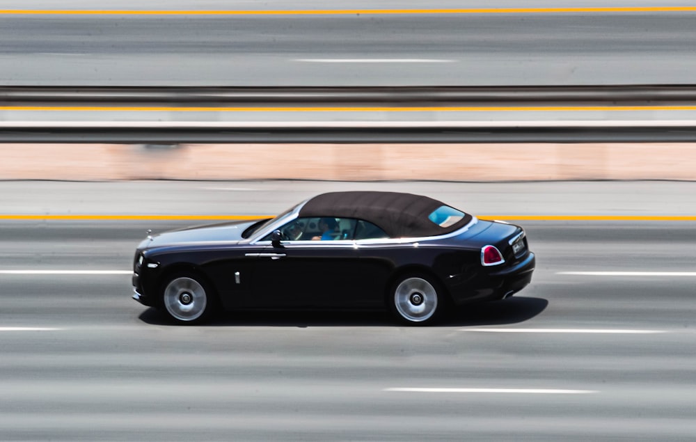 black porsche 911 on road during daytime