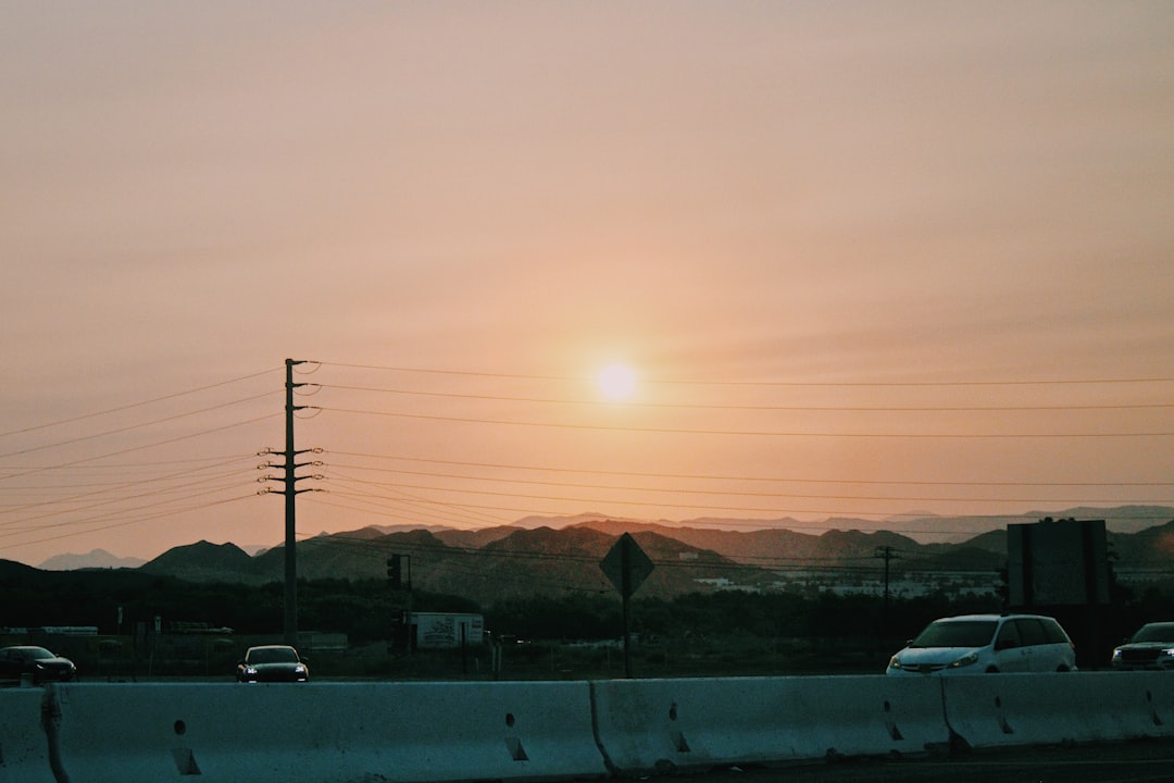 white car on road during sunset