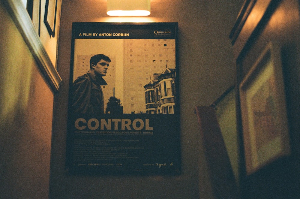 a movie poster hanging on the wall of a hallway
