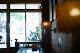 A soft pastel-toned photo of a cozy café corner with gentle morning light.