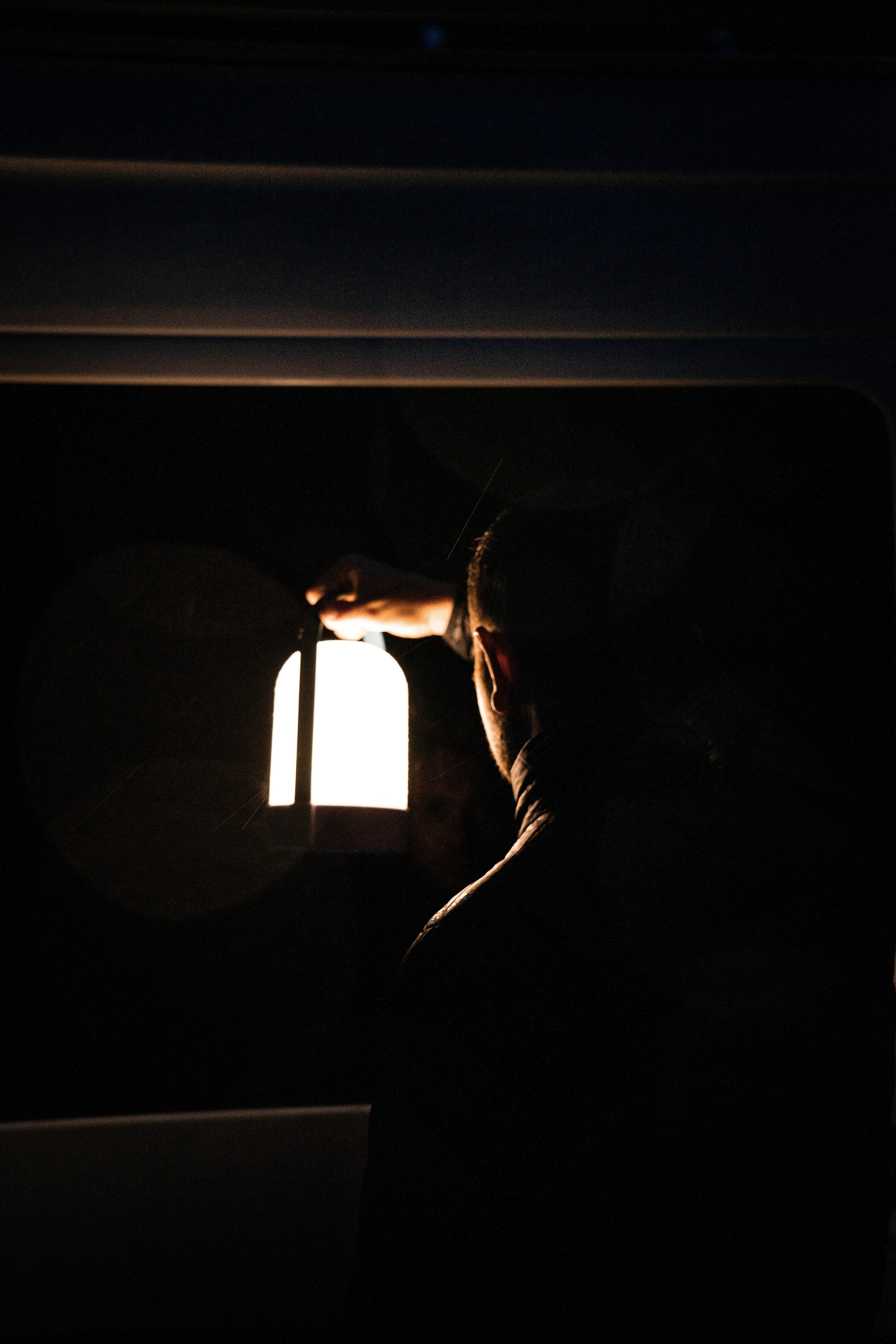 Image of someone examining a bill under a light