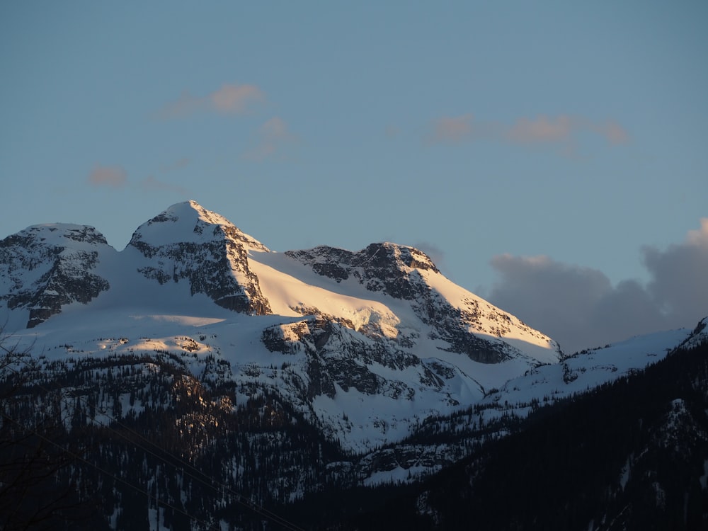 snow covered mountain under blue sky during daytime