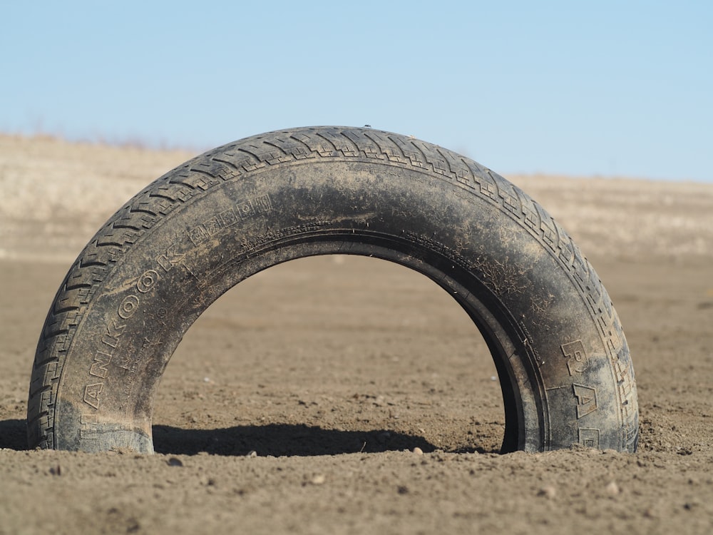 black tire on brown sand during daytime
