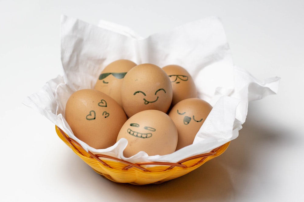 brown eggs in brown woven basket
