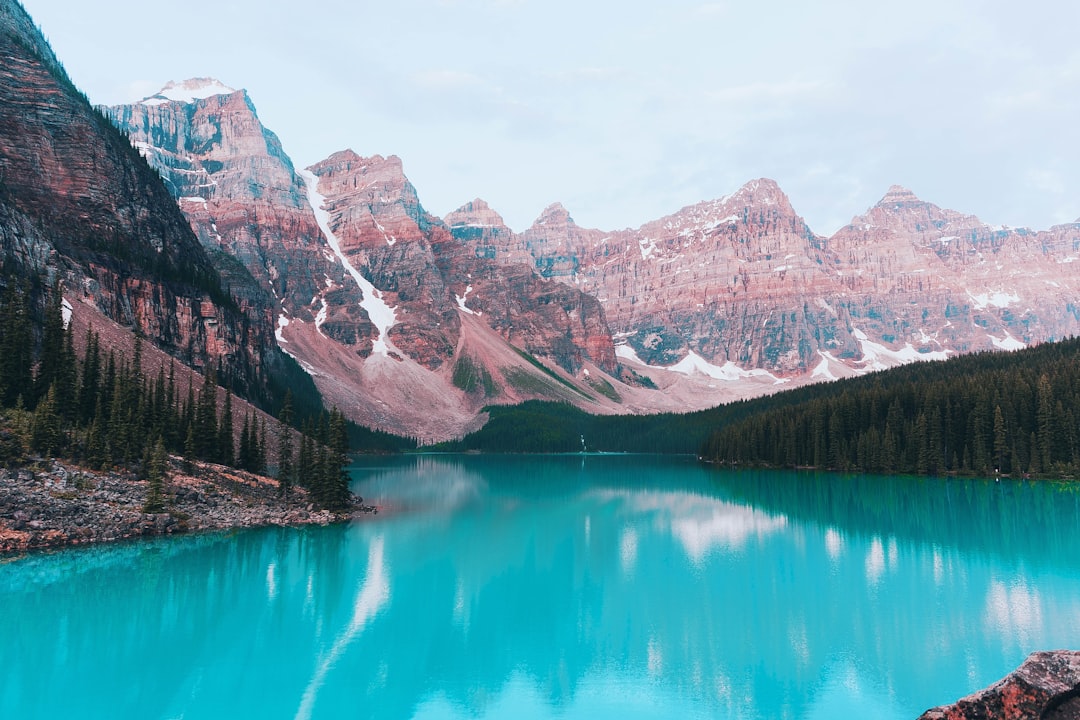 lake near mountain range during daytime