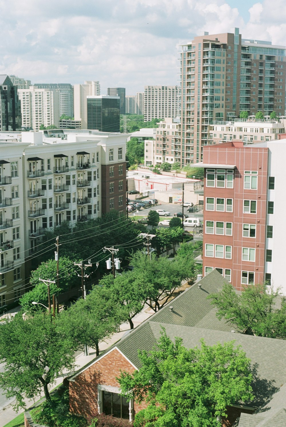 green trees near brown concrete building during daytime