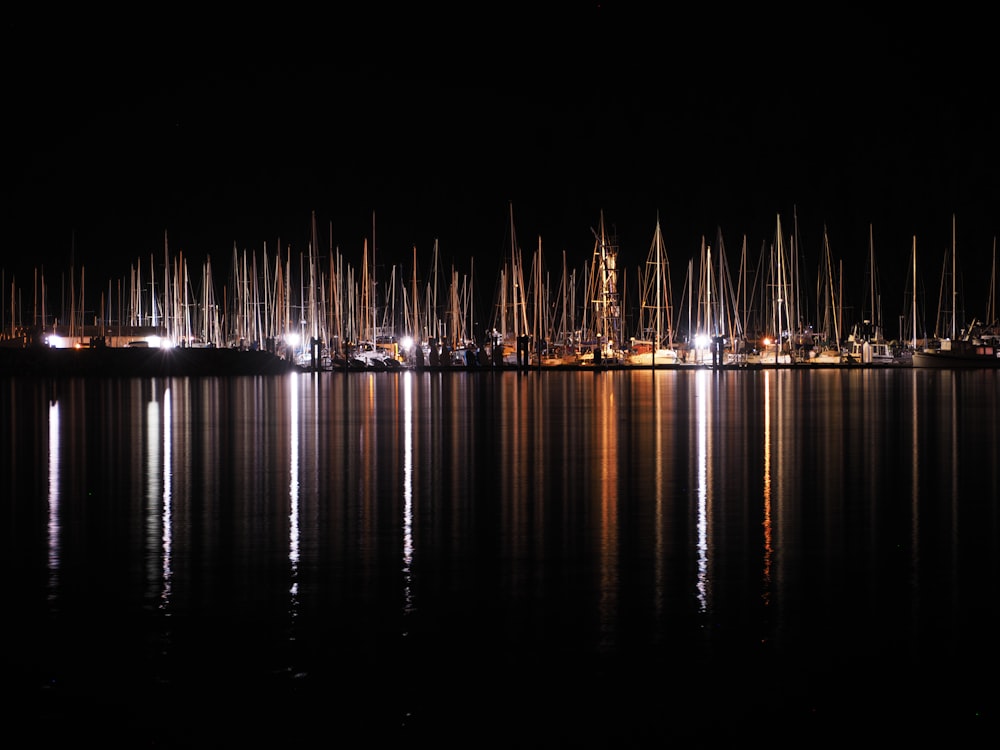 city lights reflecting on water during night time