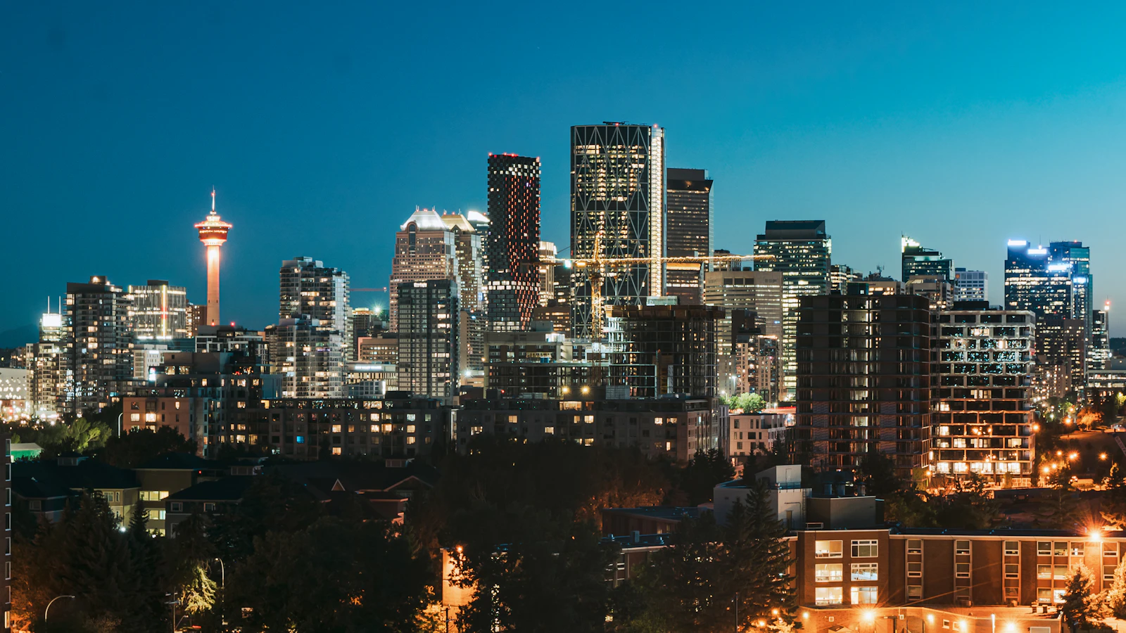 Calgary skyline with the Rocky Mountains representing Alberta