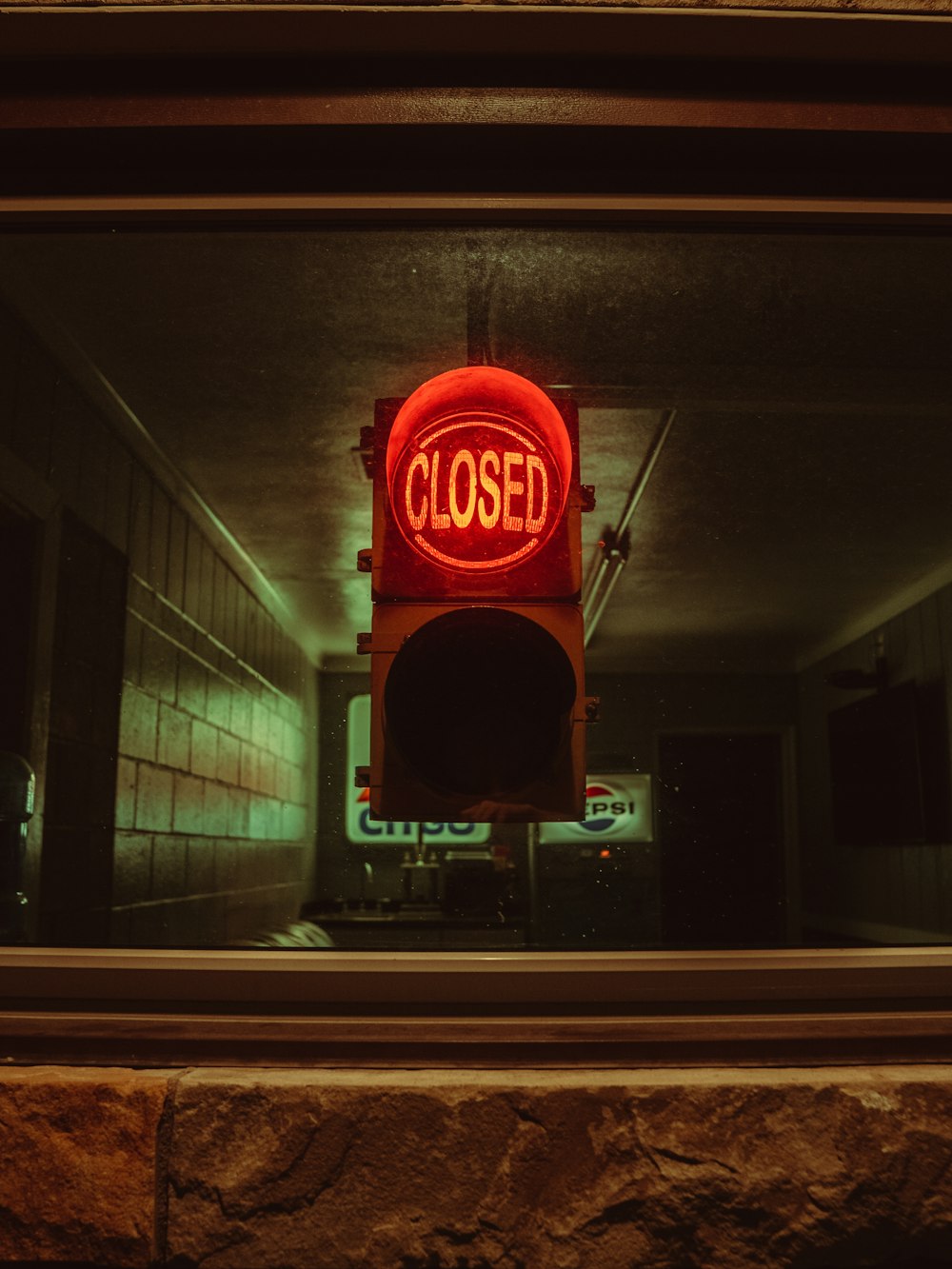 red stop light on tunnel