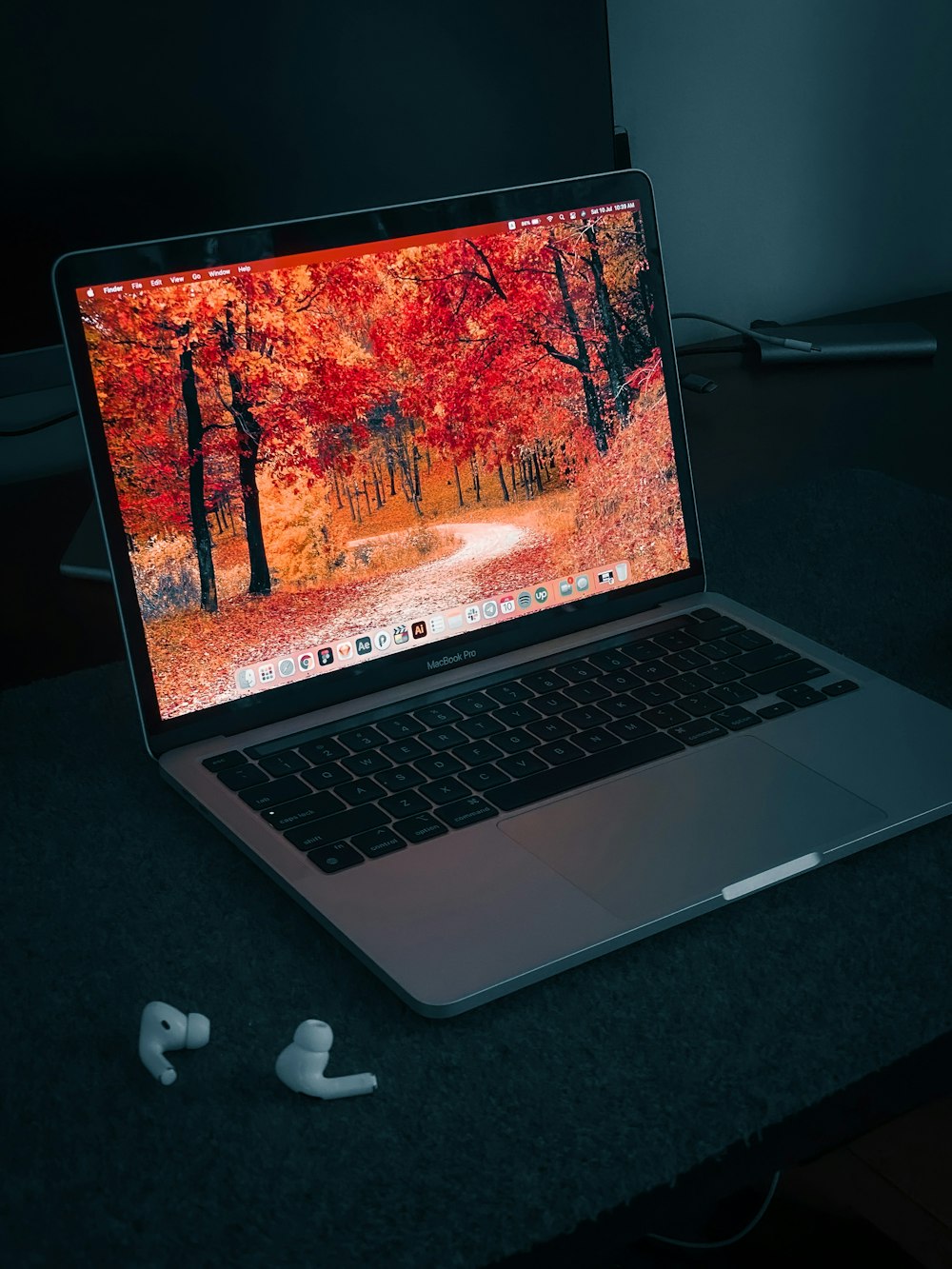 macbook pro on black table