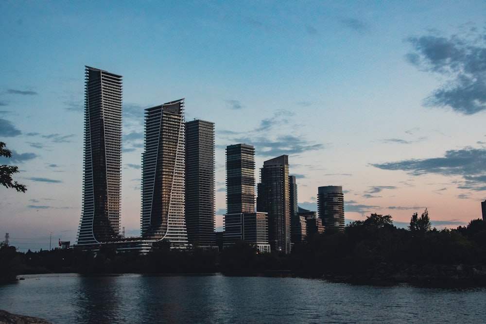 high rise buildings near body of water during daytime