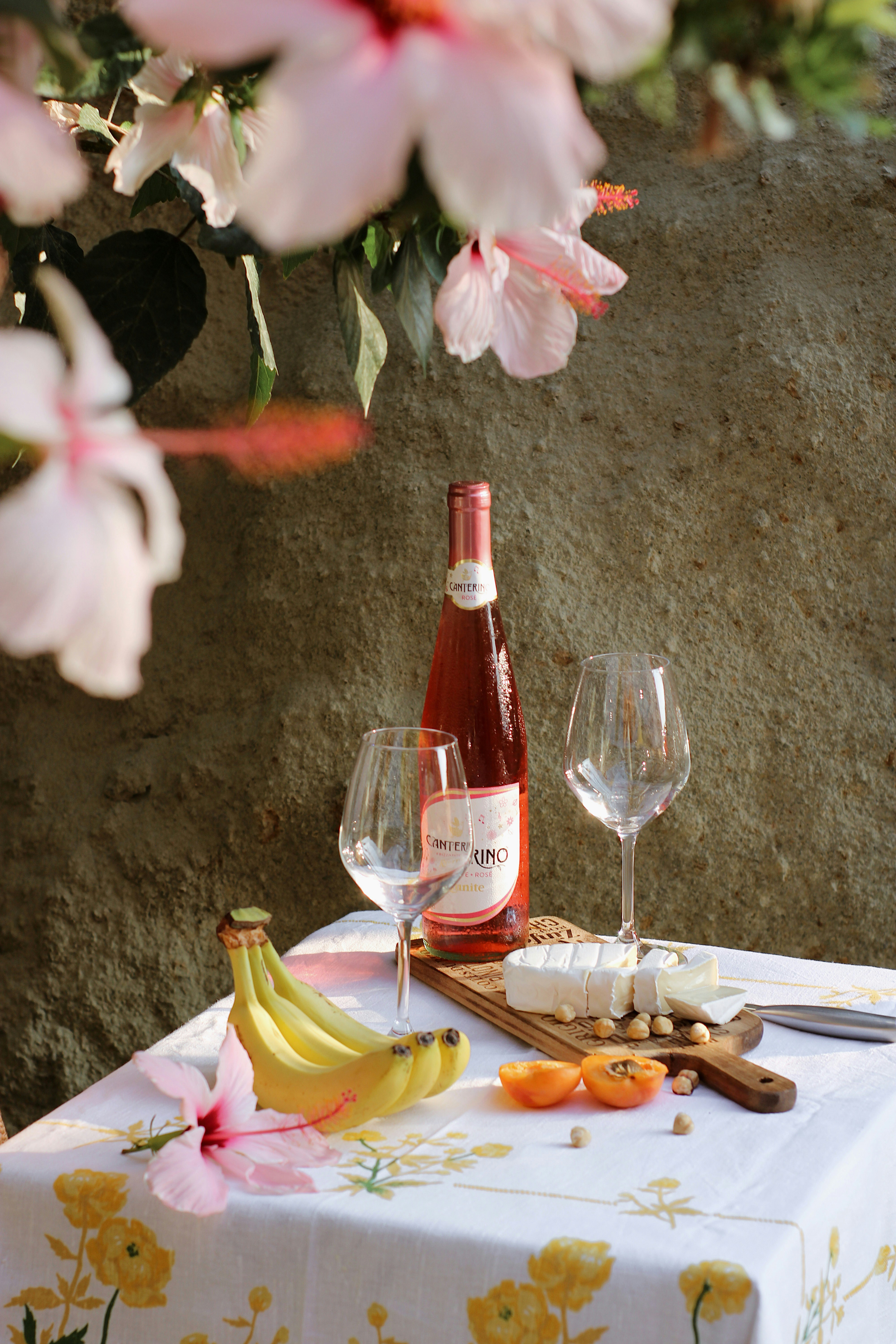white and pink flower on table