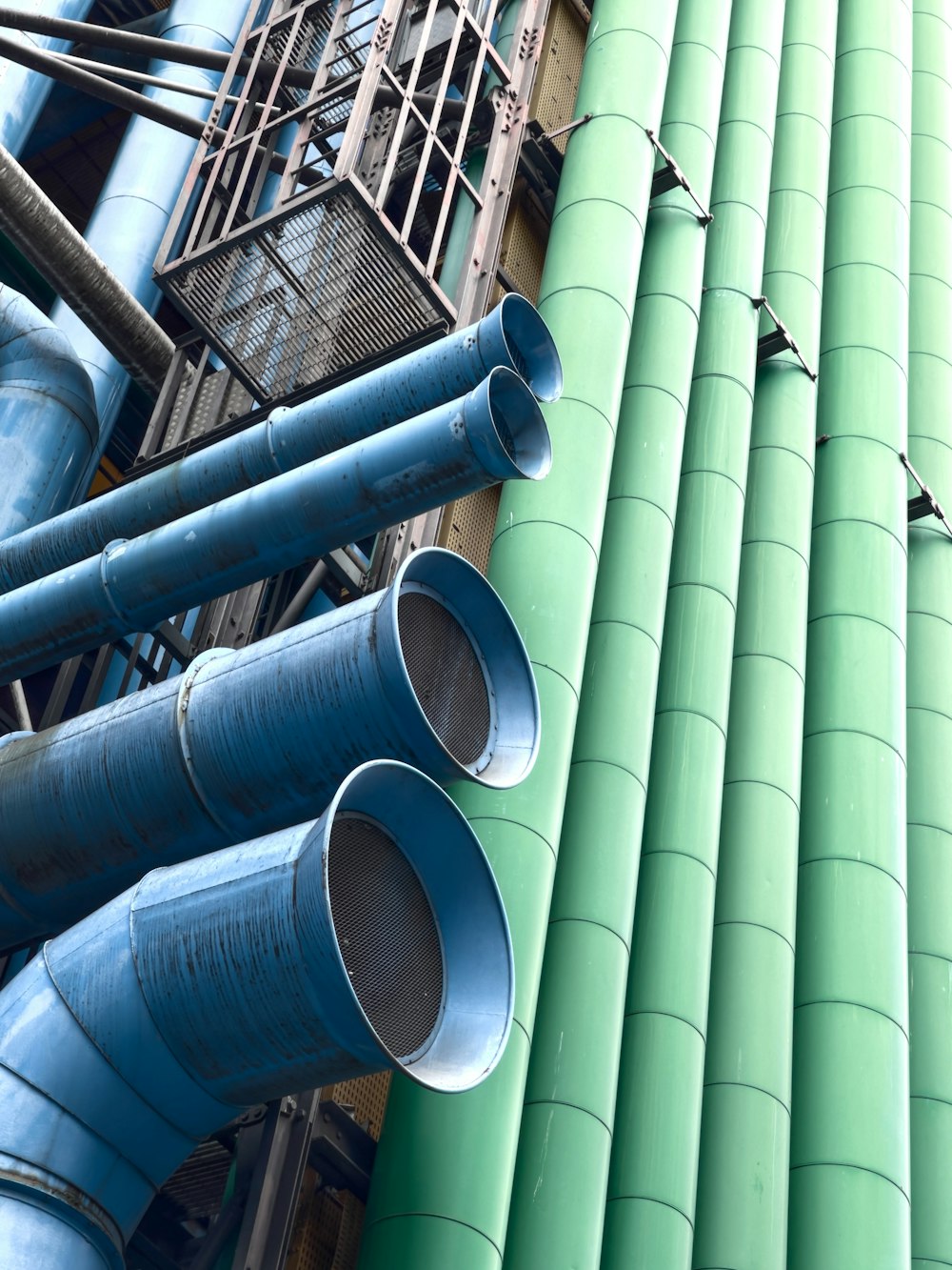 gray metal pipe lot on gray metal rack