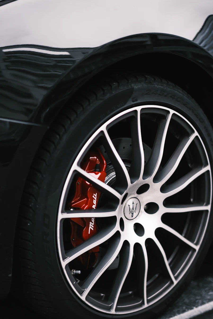 Close-up of a car wheel being serviced during a mobile brake replacement