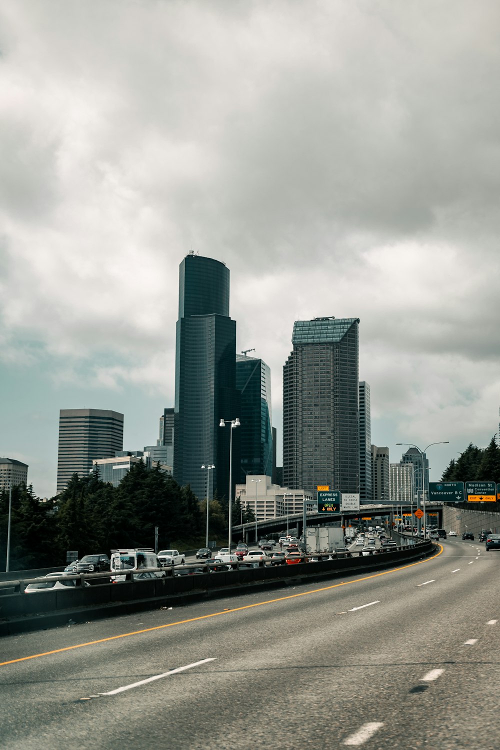 a highway with a bunch of cars driving down it