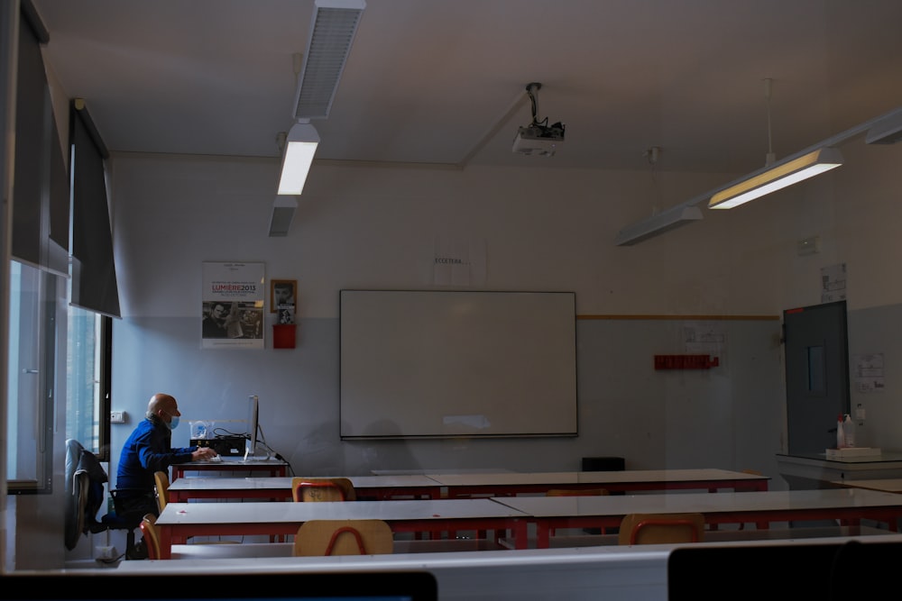 white projector screen on white wall