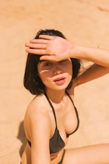 woman in black spaghetti strap top