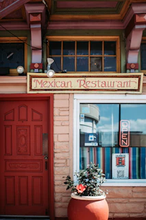 red wooden door beside black motorcycle