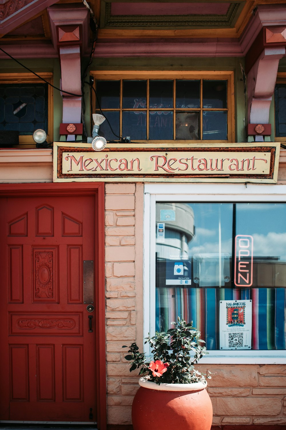 red wooden door beside black motorcycle