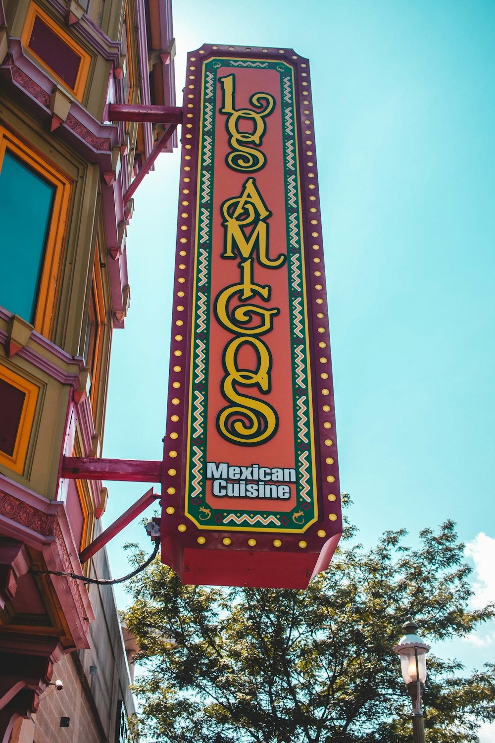 green and brown wooden signage