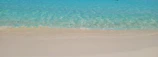 Turquoise waters gently lapping white sandy beaches of Zanzibar.