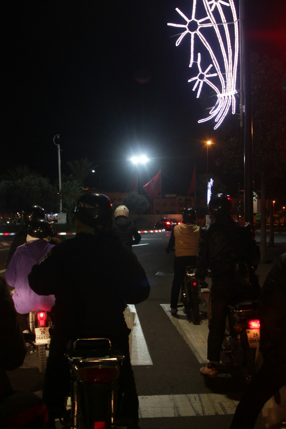 people walking on street during night time