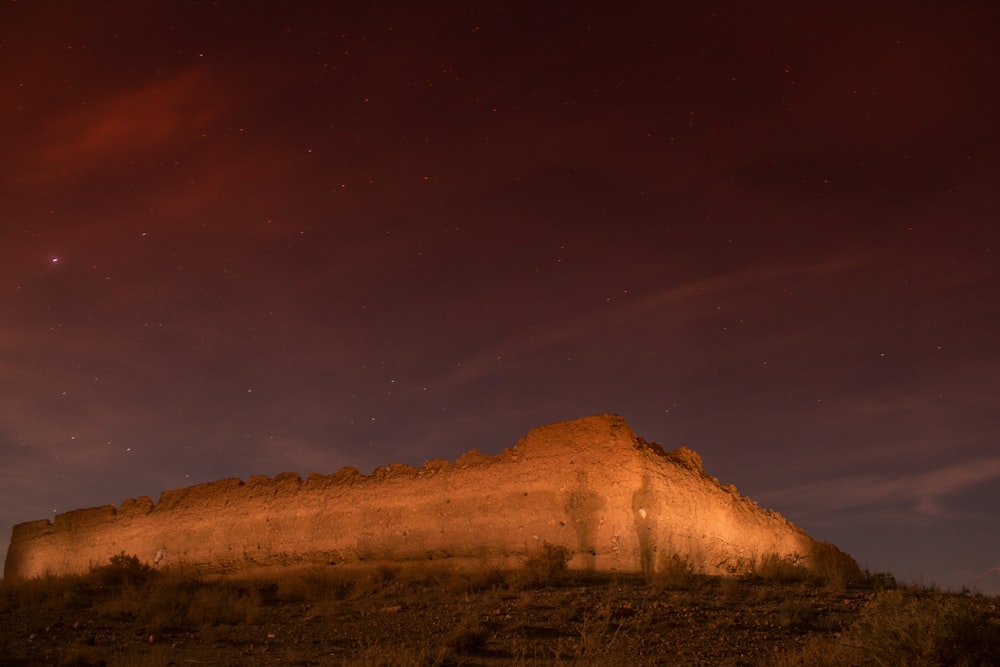 brown mountain under blue sky during night time