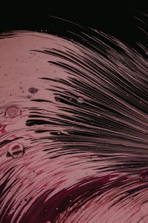 A close-up view of textured alcohol ink artistry captured in motion.