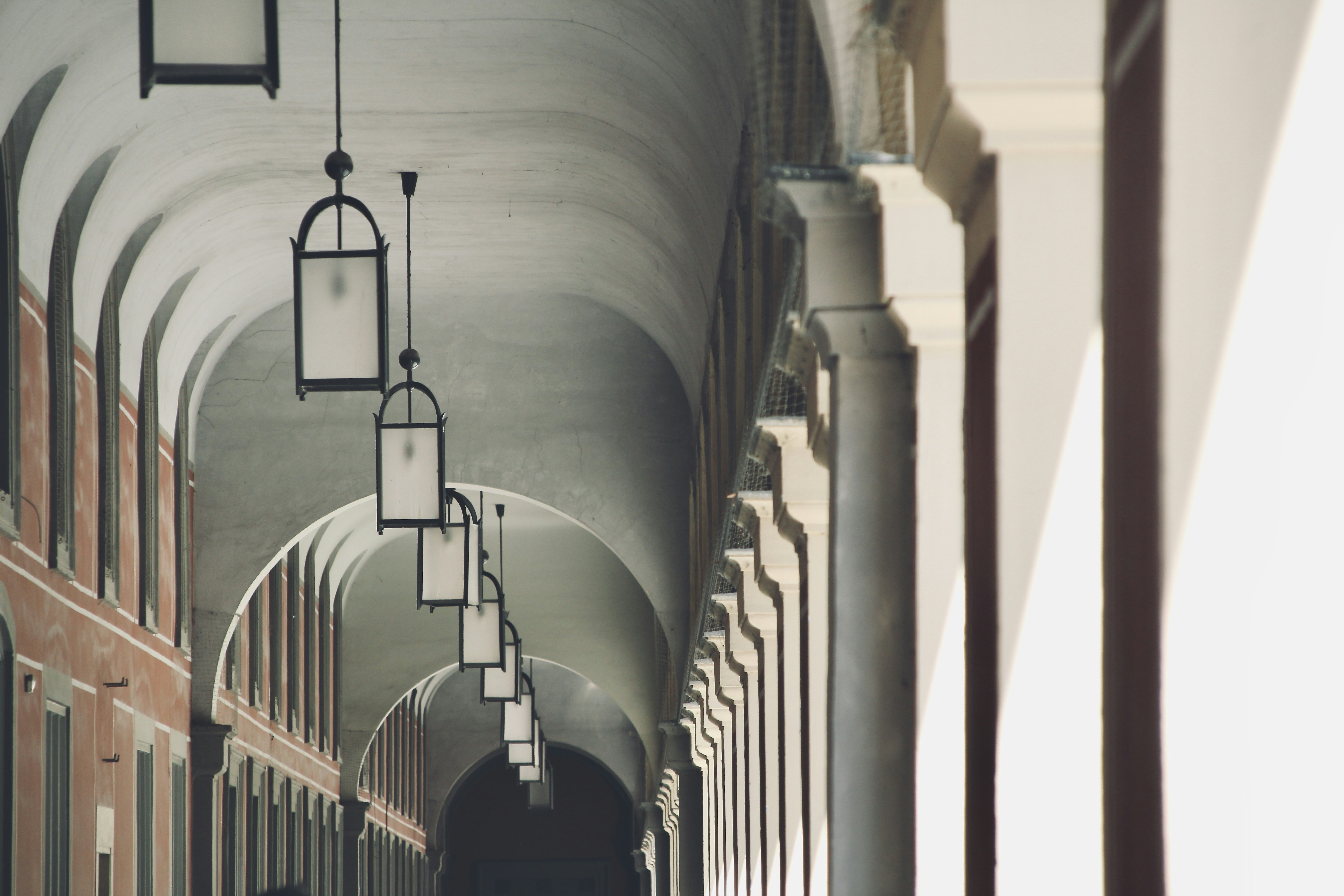 white concrete building with black metal gate