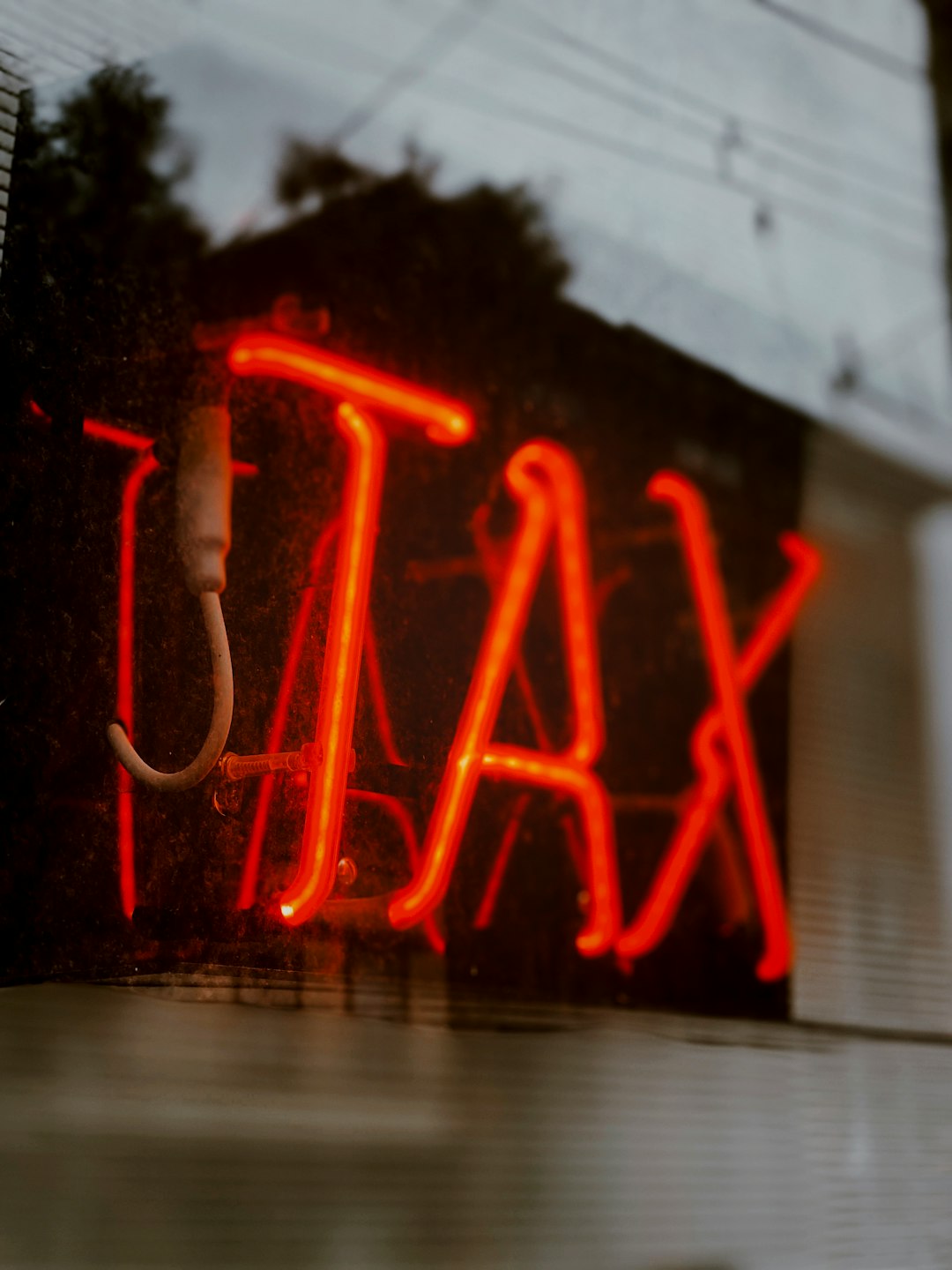 tax sign red neon