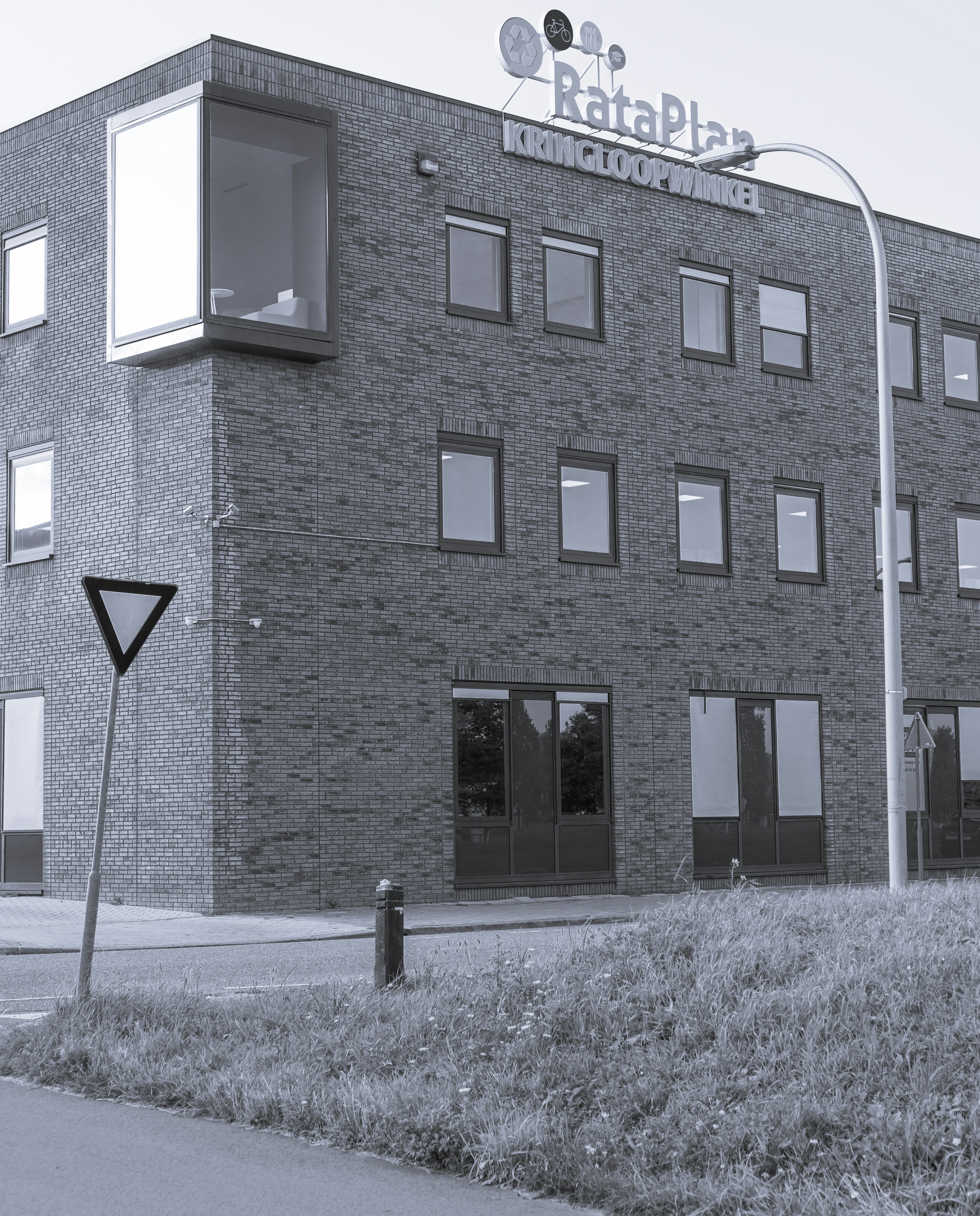 brown brick building with black door