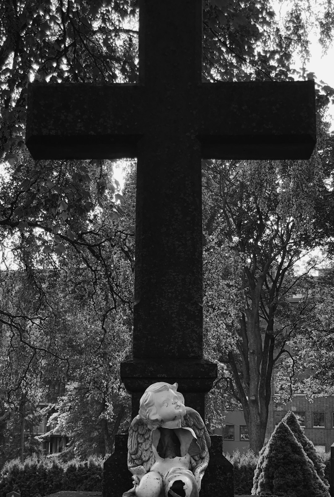 grayscale photo of cross statue