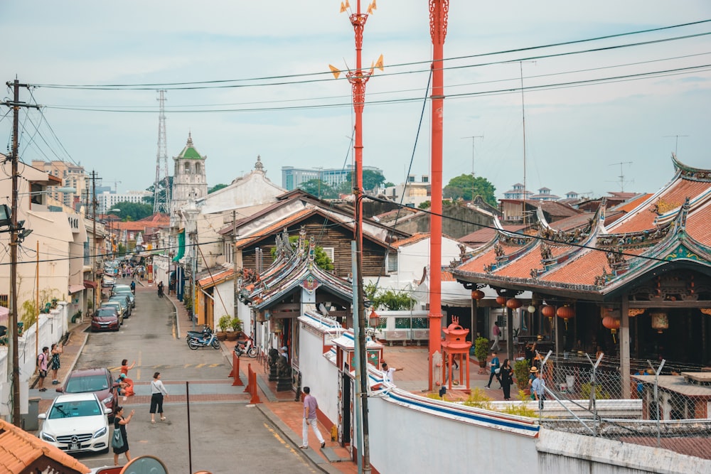 a street lined with buildings and people walking down it