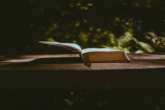 book page on brown wooden table