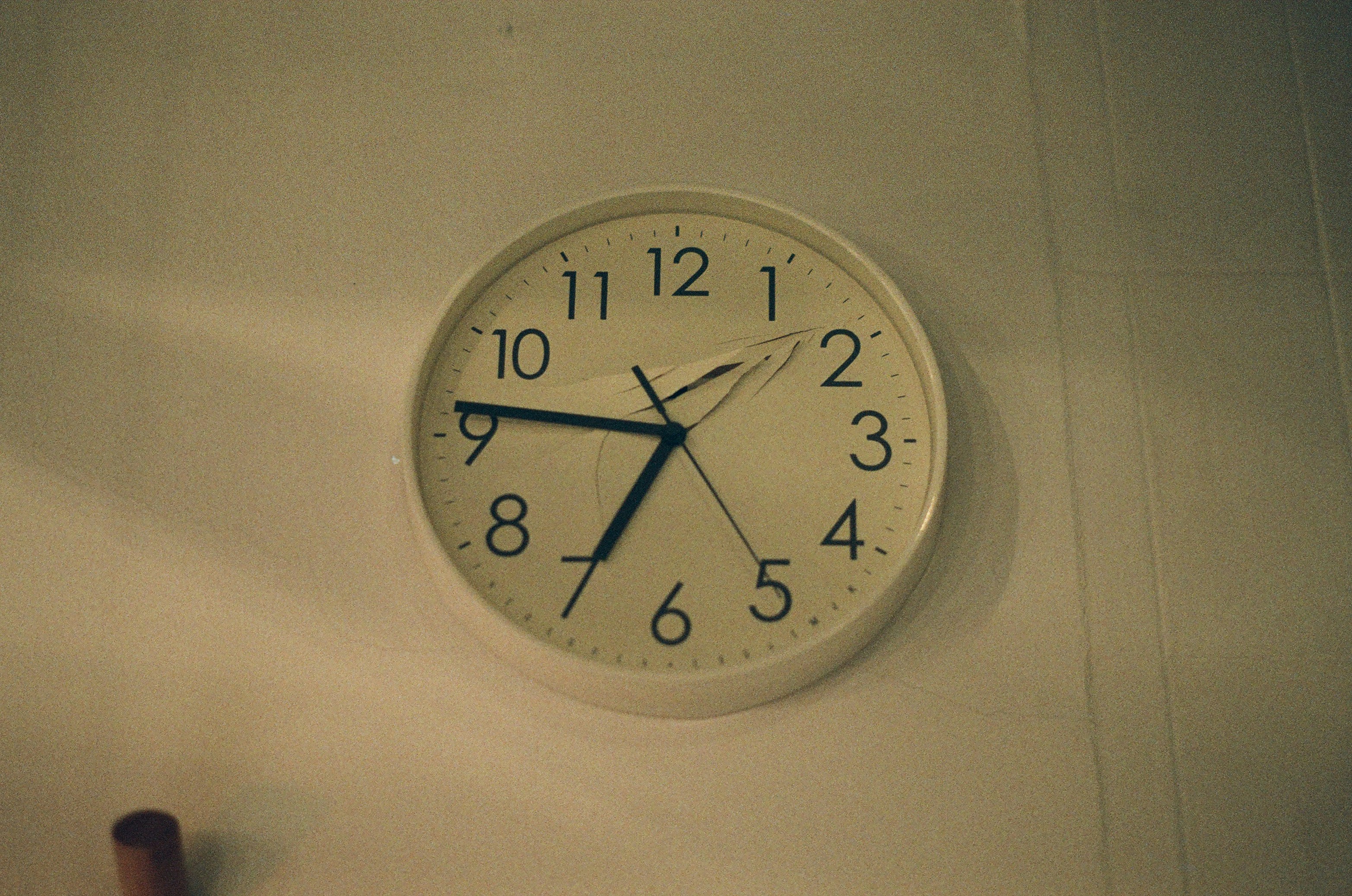 white analog wall clock at 10 00