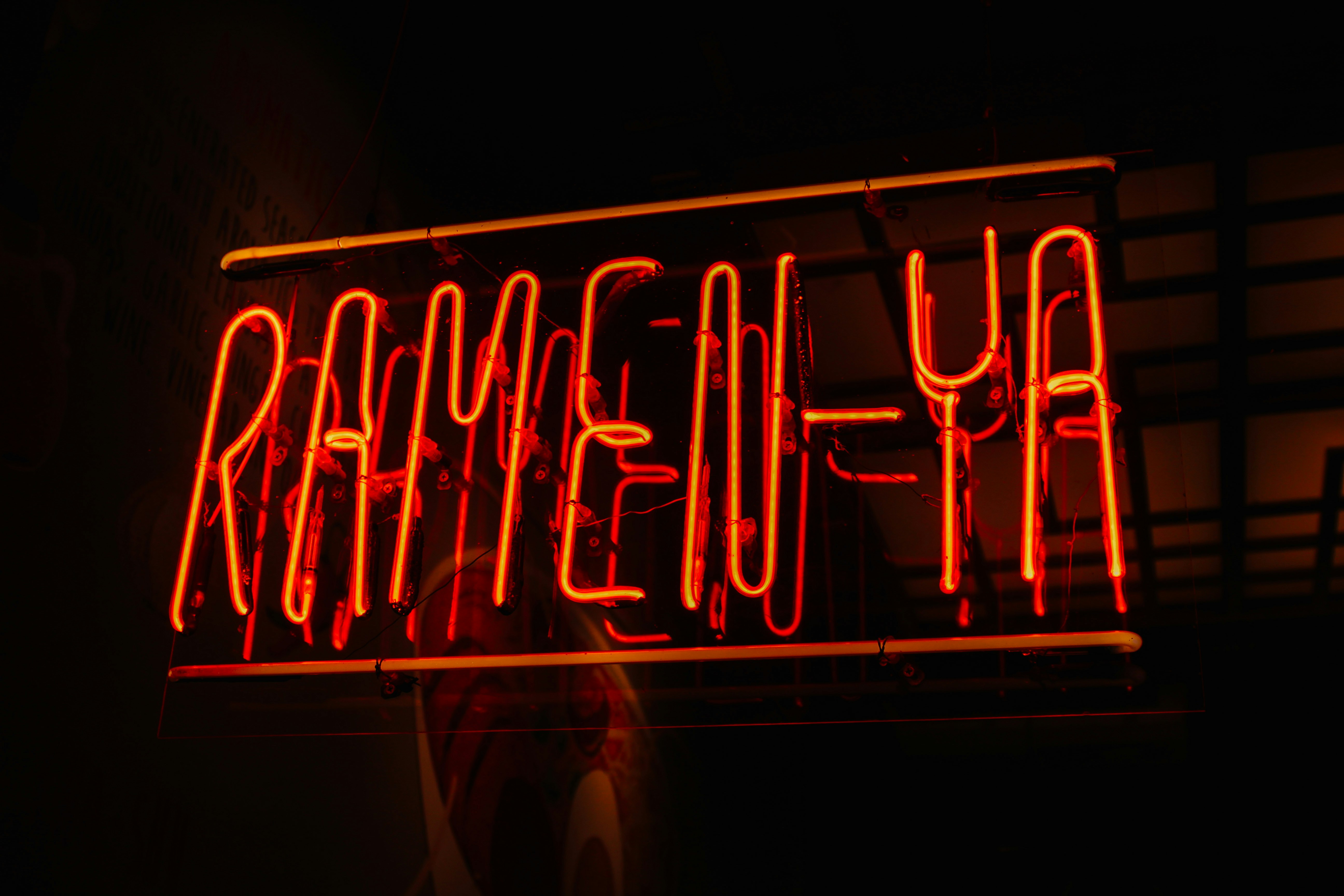 a red neon sign that reads, heyemar